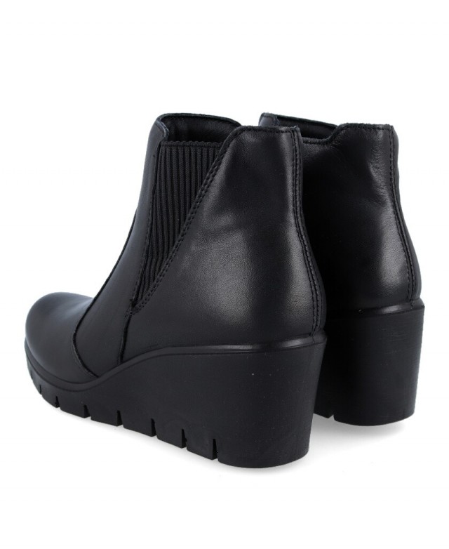 Black wedge dress sales boots